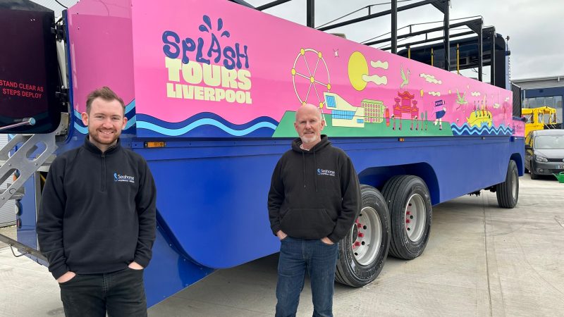 a man standing in front of a truck