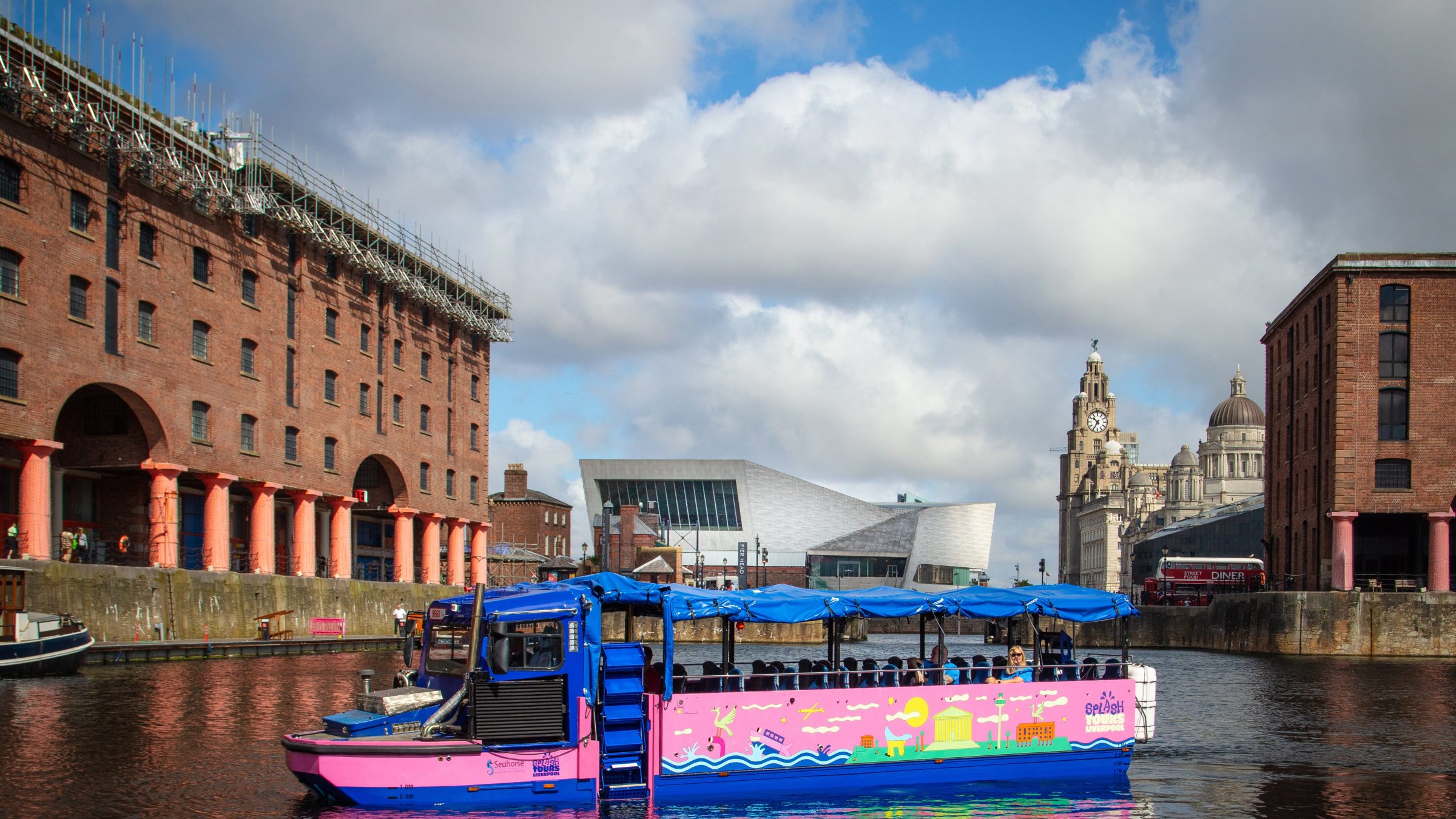 a small boat in a harbor in front of a building